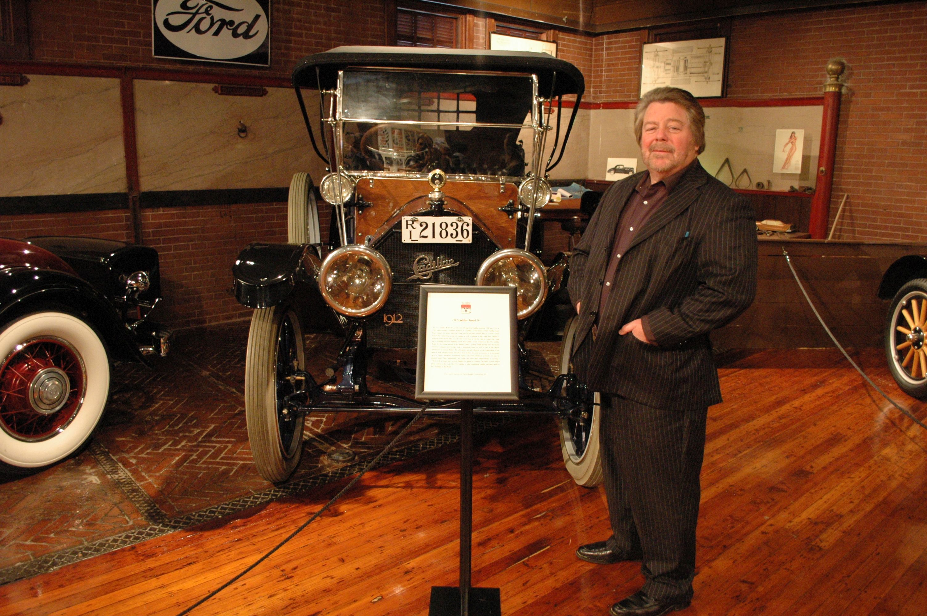 Dick posing with his 1912 Cadillac
